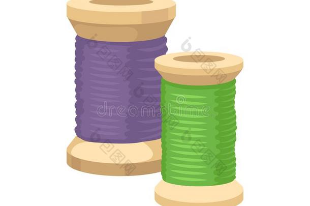 两个木制的管和绿色的和紫色的线.缝纫材料