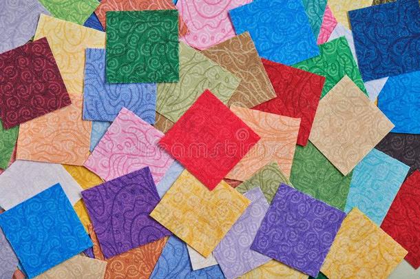 堆正方形一件关于富有色彩的织物为制造被子