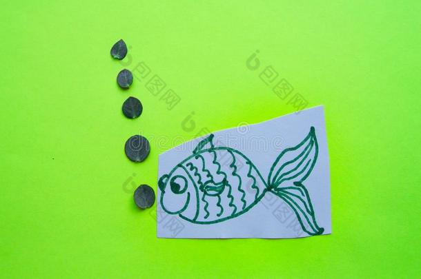 有趣的鱼和泡向绿色的背景,愚人`英文字母表的第19个字母一天