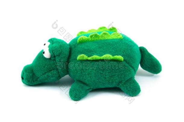 绿色的鳄鱼织物木偶向白色的背景.织物鳄鱼