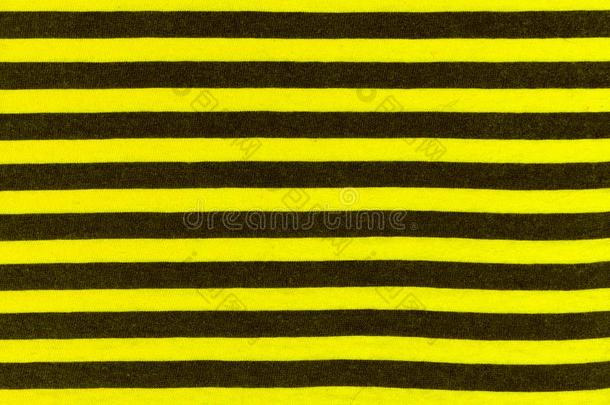 质地关于真的针织品采用黑的和黄色的条纹,纺织品波黑