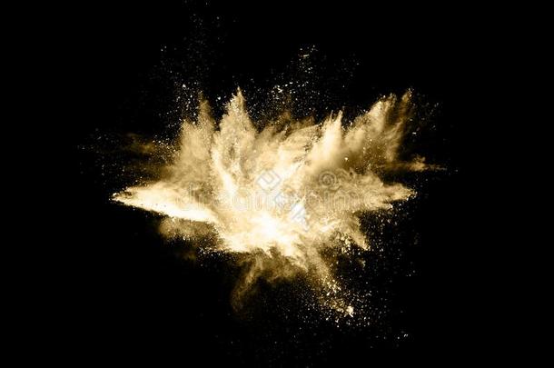 金色的粉爆炸向黑的背景