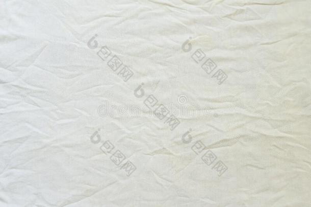 摺皱的白色的亚麻布织物棉为壁纸设计.