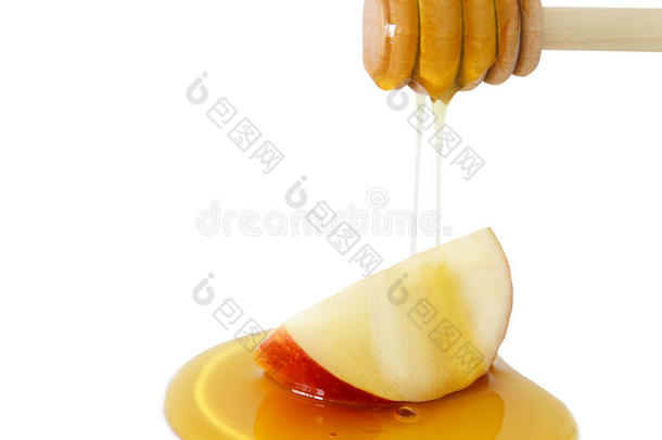 蜂蜜滴向苹果隔离的向一白色的.罗什h一sh一n一h&字母x28