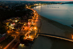 海边日落晚霞蓬莱八仙过海夜景航拍摄影图