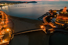 海边日落晚霞蓬莱八仙过海夜景航拍摄影图