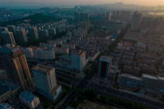 山东烟台城市清晨日出彩霞航拍摄影图