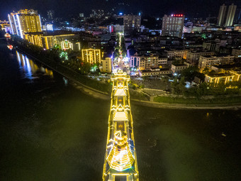 少数民族风雨桥特色建筑夜景灯光航拍摄影图