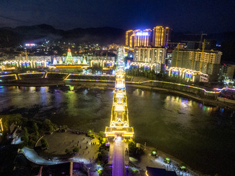 少数民族风雨桥特色建筑夜景灯光航拍摄影图