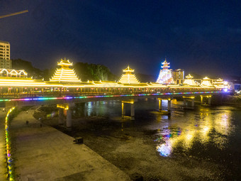 少数民族风雨桥特色建筑夜景灯光航拍摄影图