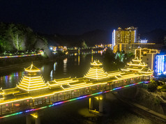 少数民族风雨桥特色建筑夜景灯光航拍摄影图