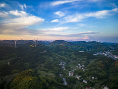 夕阳晚霞山川风车发电航拍摄影图