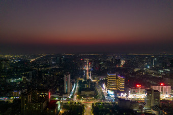 广东湛江夜幕降临夜景灯光彩霞航拍摄影图