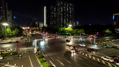 城市十字交叉路口交通车辆行驶夜景航拍摄影图