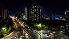 城市十字交叉路口交通车辆行驶夜景航拍摄影图