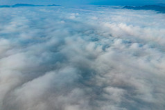 云层之上云海蓝天白云山川航拍摄影图