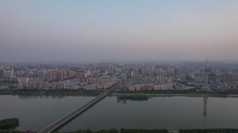 河南洛阳城市清晨日出彩霞航拍