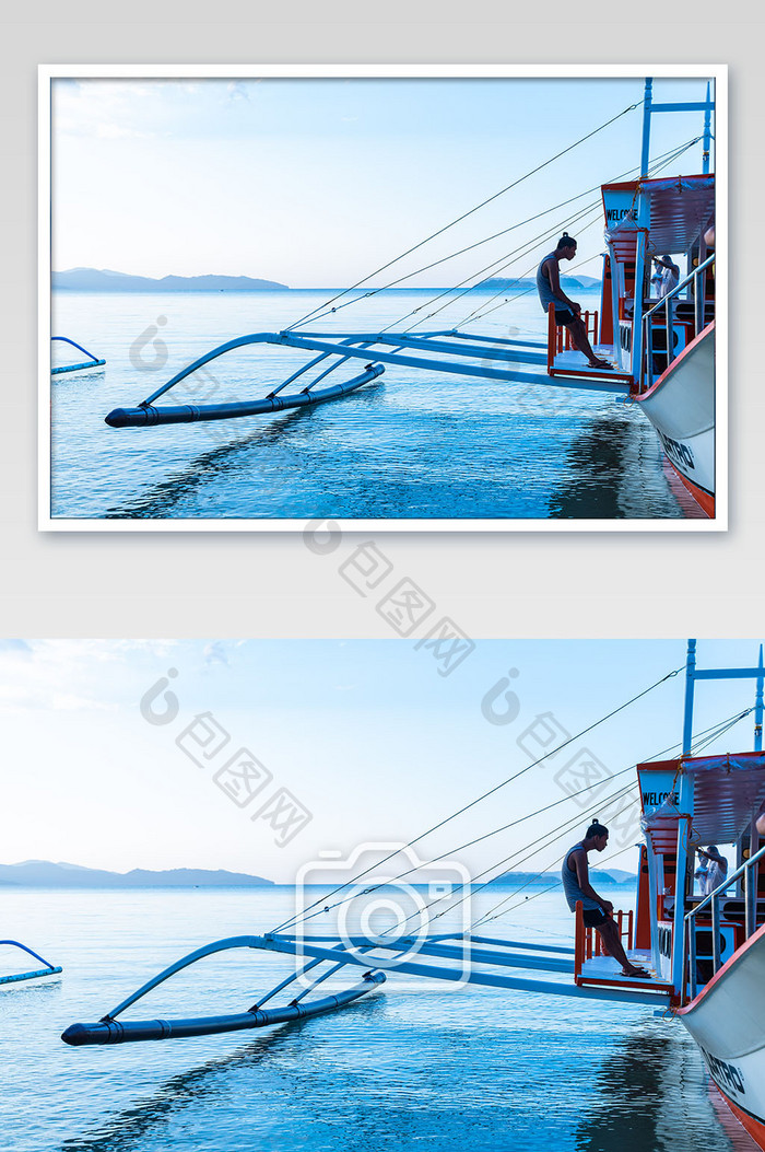 东南亚渔船上倚靠休息的男人摄影图