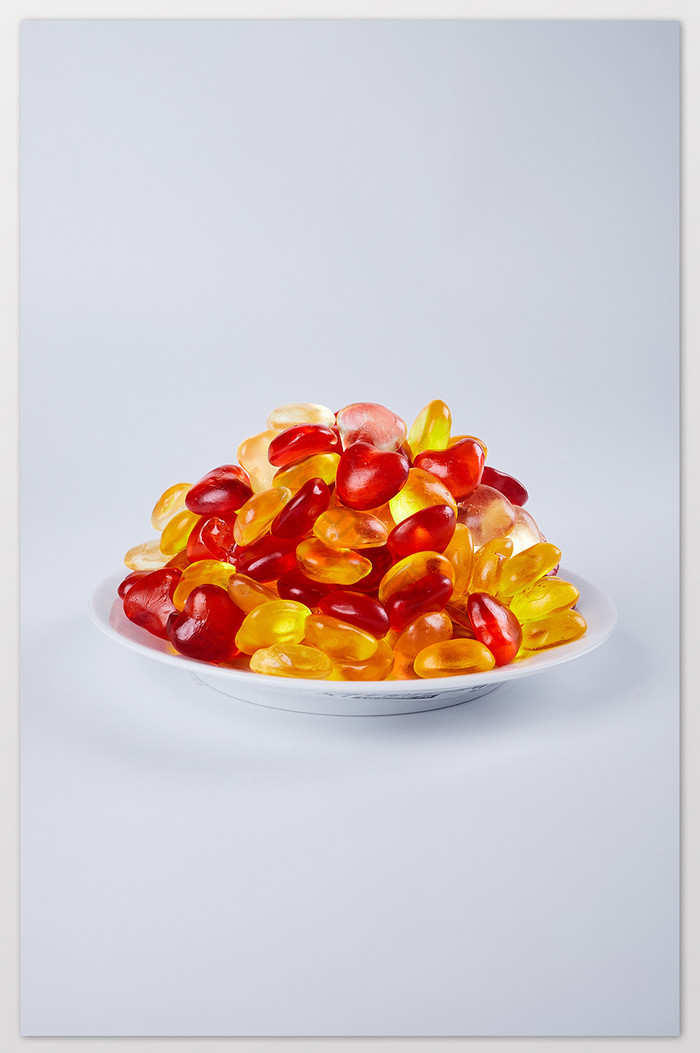 爱心软糖透明彩色桌布木勺零食美食摄影图片