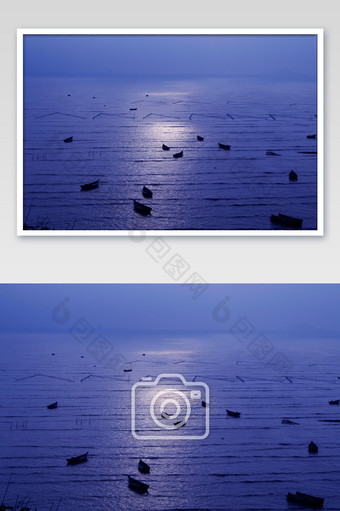 清晨阳光撒落海边船只剪影摄影图图片