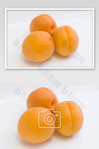 三个杏横版白色背景特写图片