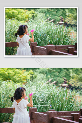 小孩吹泡泡公园玩耍摄影图图片