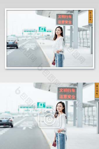 站在路边拉着行李等车的美女摄影图片