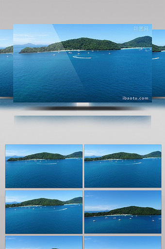 高清高空航拍国外海岛全景及行驶中的游艇图片