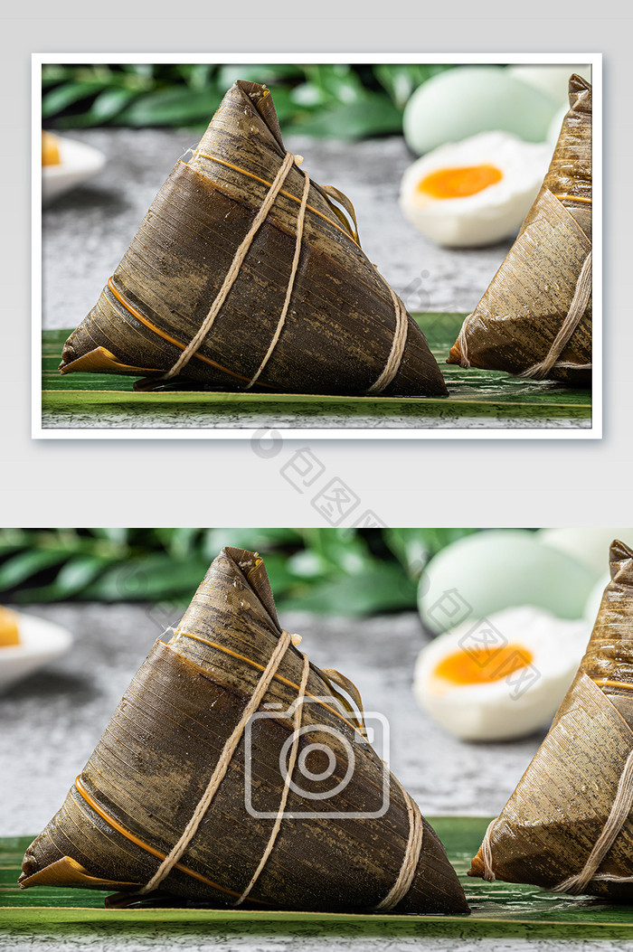 粽叶上的端午美食蛋黄鲜肉粽摄影图