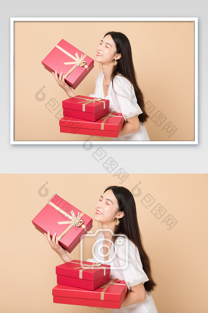 年轻美女开心拿着礼物盒人像图片