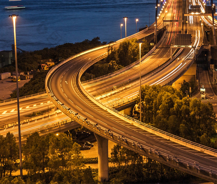 唯美晚霞中城市中的桥梁摄影图手机壁纸