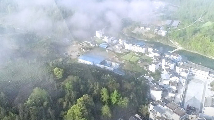 皖南黄山好风光航拍俯瞰云层下山村河流