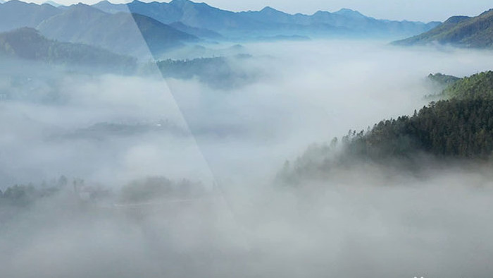 航拍大规模云海苍山峻岭环绕群山