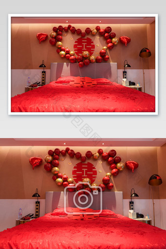 红色床头墙上有红双喜静物摄影图片
