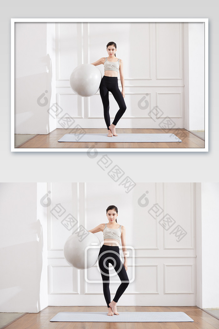 瑜伽健身普拉提女性站立怀抱瑜伽球图片