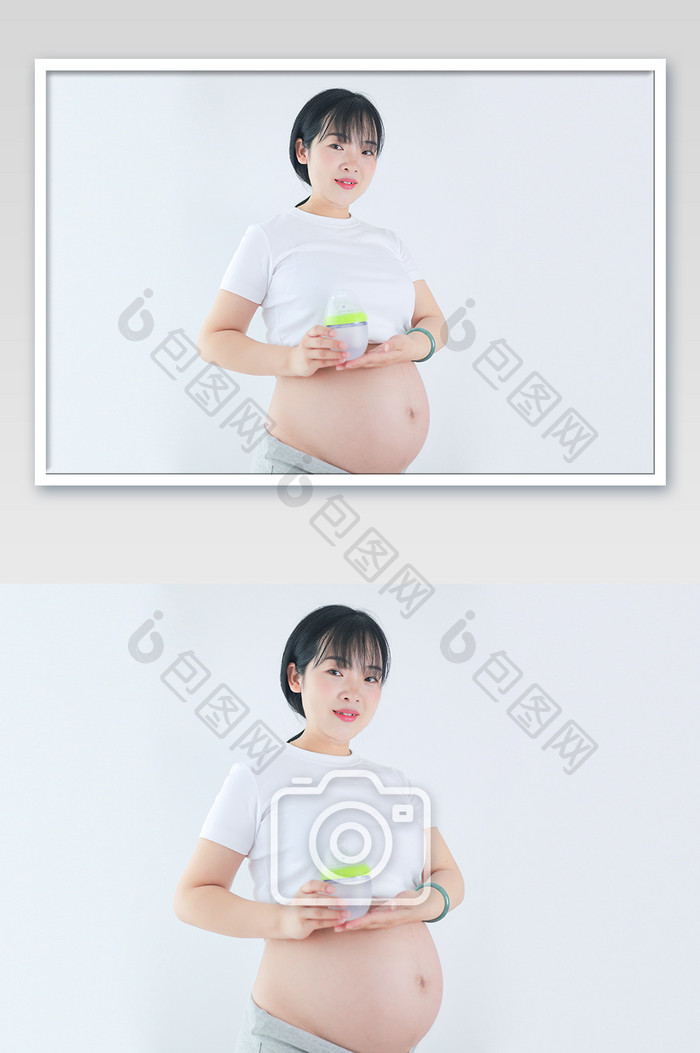 年轻孕妇孕肚怀孕举宝宝奶瓶摄影图