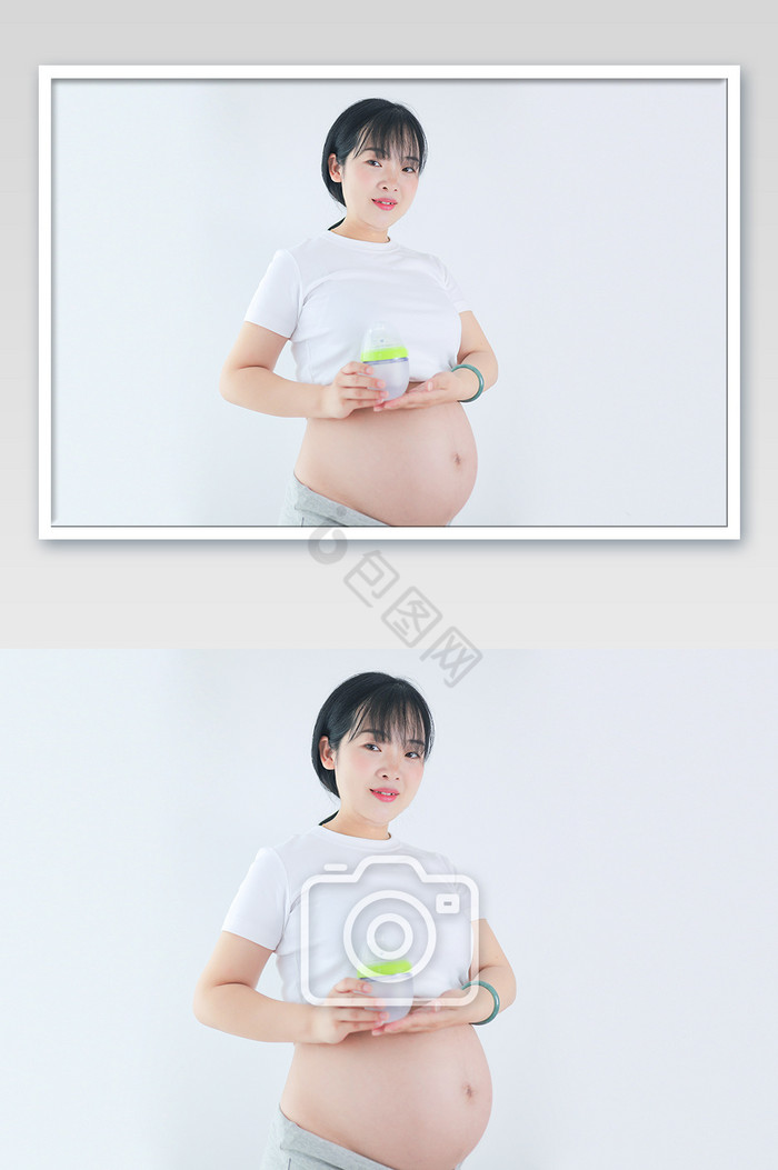 年轻孕妇孕肚怀孕举宝宝奶瓶摄影图图片