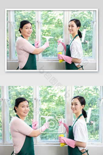 家政服务保洁人员对着玻璃做卫生图片