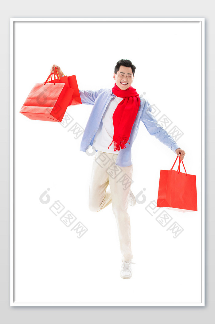 春节新年男性手持购物袋跳跃