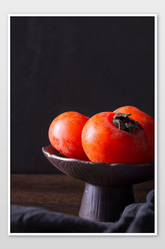 柿子水果装盘图黑底图片