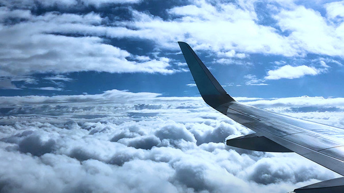 航拍浙江高空云层雨中飞机飞行景观实拍素材