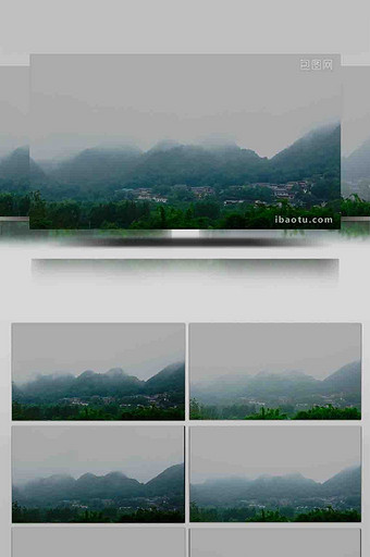 延时阴雨村寨山雾环绕图片