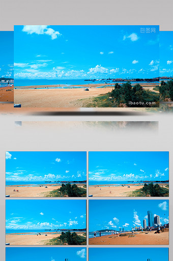 晴空蓝天白云海边沙滩海岸城市赶海人群延时图片