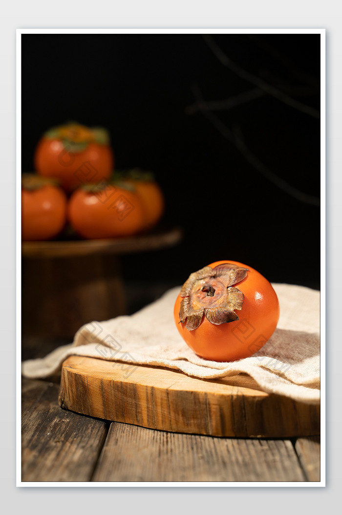 秋天新鲜创意柿子摄影图