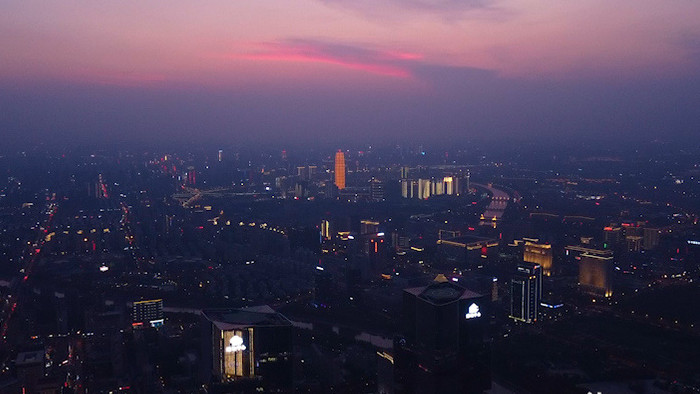 航拍郑州郑东新区绿地中心双子塔黄昏夜景