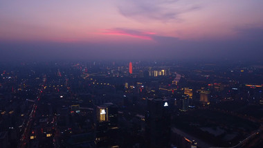 航拍郑州郑东新区绿地中心双子塔黄昏夜景