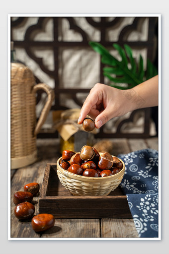 冬季美食创意糖炒栗子摄影图图片