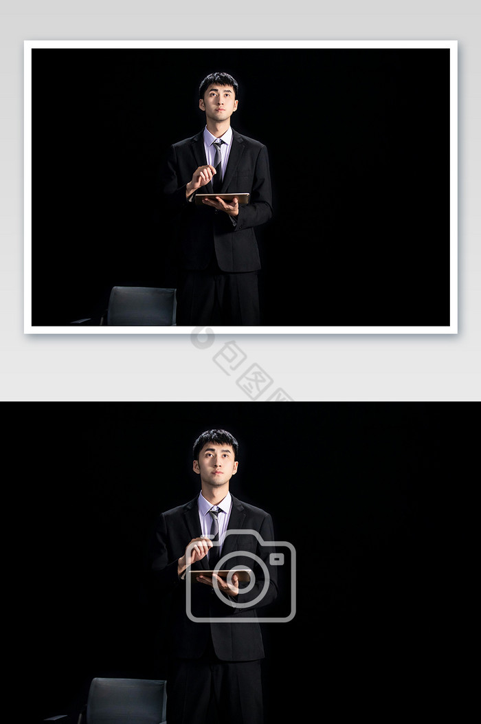 商务年轻西装男点击平板抬头看科技摄影图图片图片