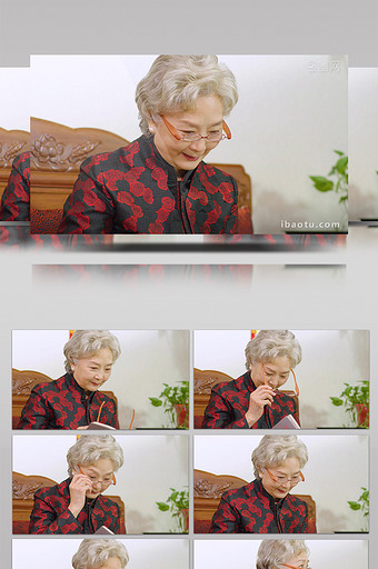 4k戴眼镜看书的慈祥奶奶中老年女性图片
