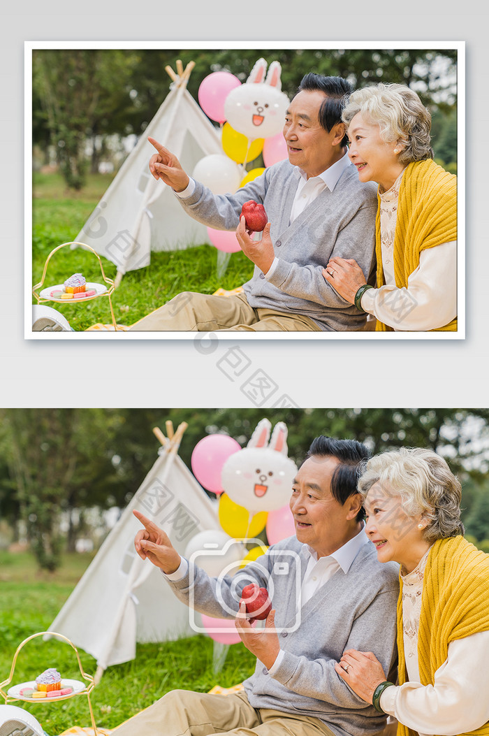 清新老年夫妇吃苹果指向远方摄影图片